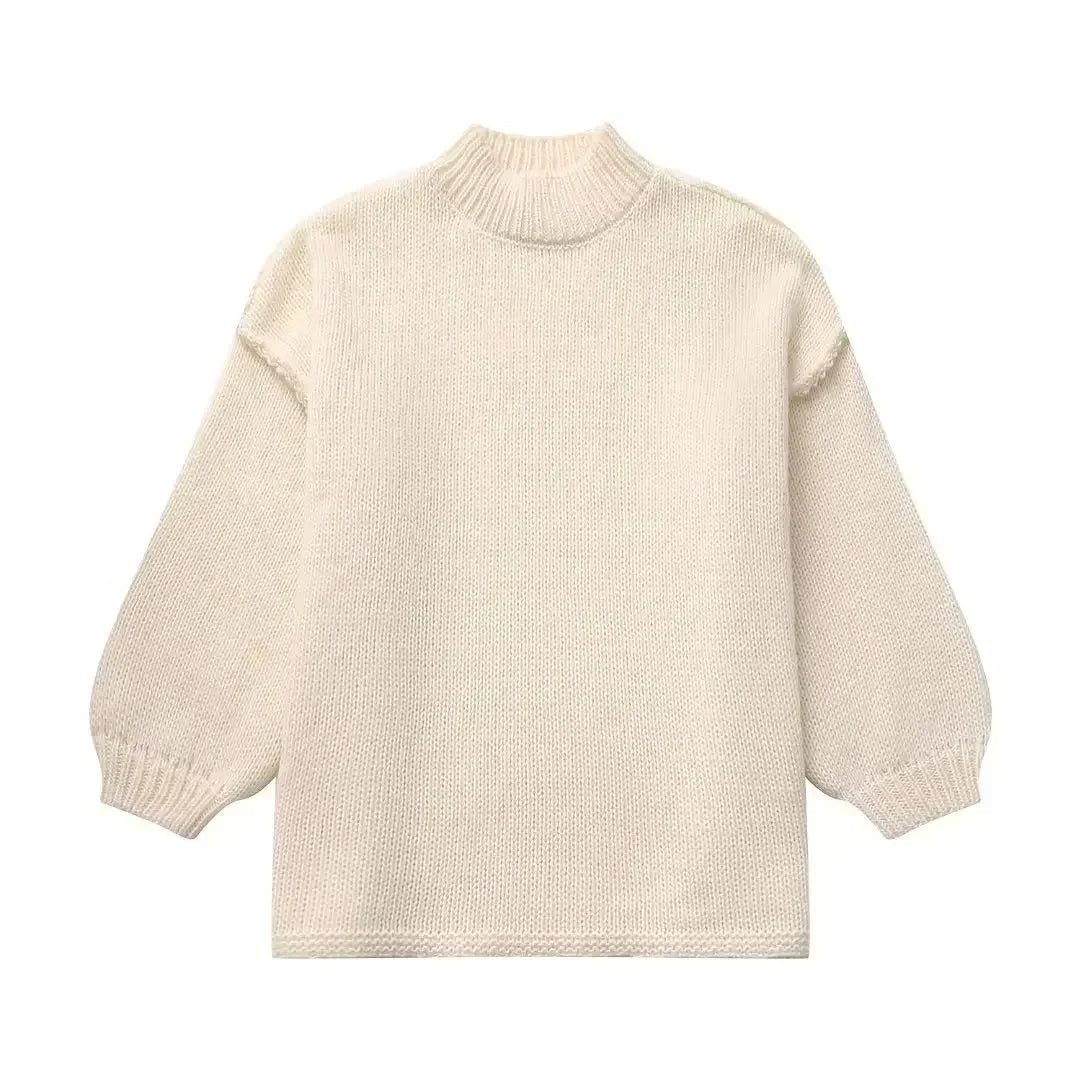 Pull à col roulé en maille douillette avec manches bouffantes tendance