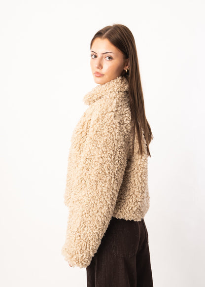 Veste douillette en peau de mouton bouclée