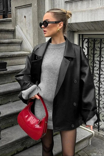 Manteau en cuir noir à double boutonnage avec col à revers