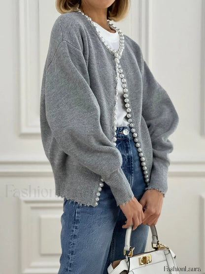Cardigan en tricot avec ourlet déchiré et bordure perlée