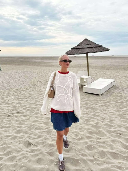 Pull surdimensionné confortable avec détails brodés élégants
