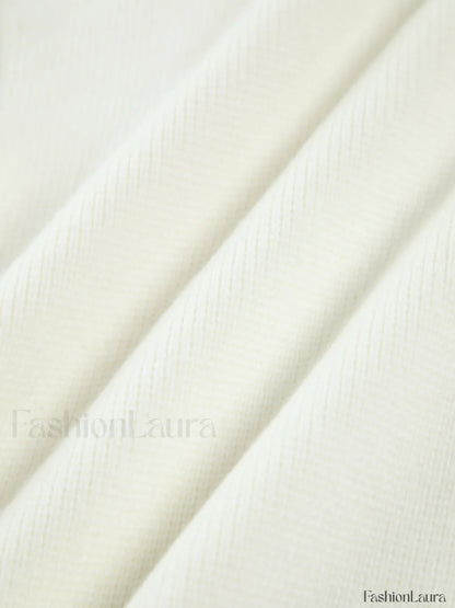 Cardigan en tricot avec ourlet déchiré et bordure perlée