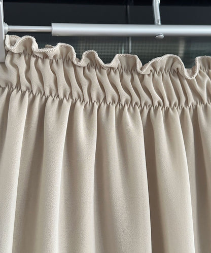 Robe chic beige d'inspiration fauteuil à bascule