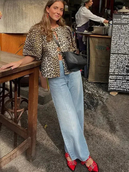 Blouse à manches bouffantes imprimé léopard avec détail nœud