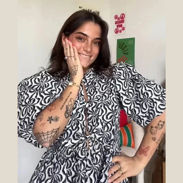 Blouse à manches bouffantes imprimé léopard avec détail nœud