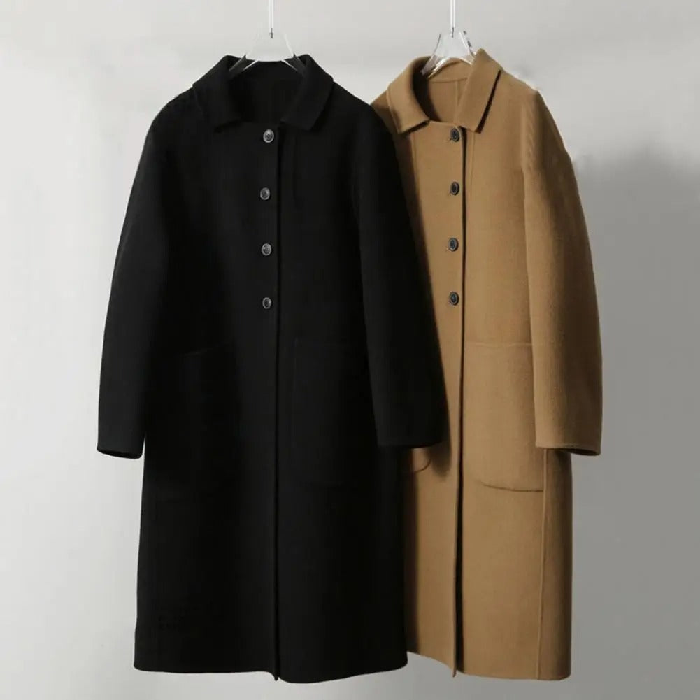 Elégant manteau noir avec manches bouffantes et encolure ronde